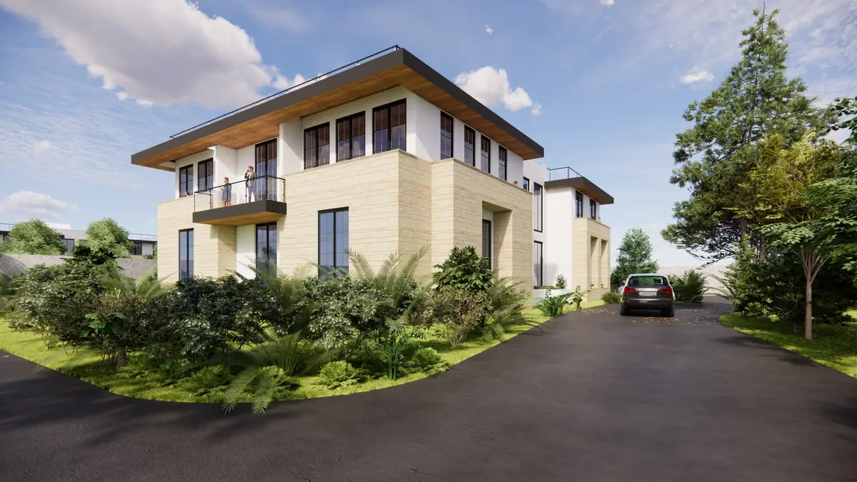 Corner view from the curving driveway, with the cantilevered balcony and stone base