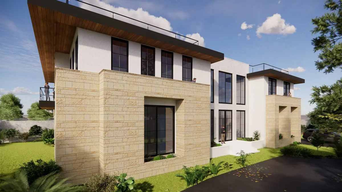 Stone-clad wing with a deep-set window, under the timber soffit of the roof plane