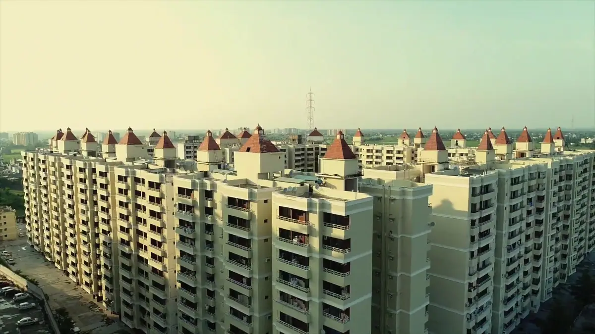 Drone view over the red-roofed towers of Ratan Orbit
